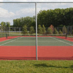 Pourquoi le climat parisien influence-t-il la construction de courts de tennis en béton poreux à Paris ?